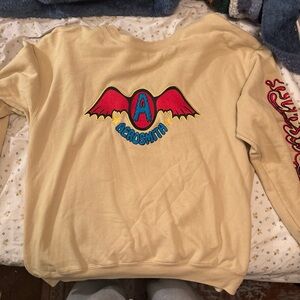 American Girl Beige Sweater with Vibrant Wing Design